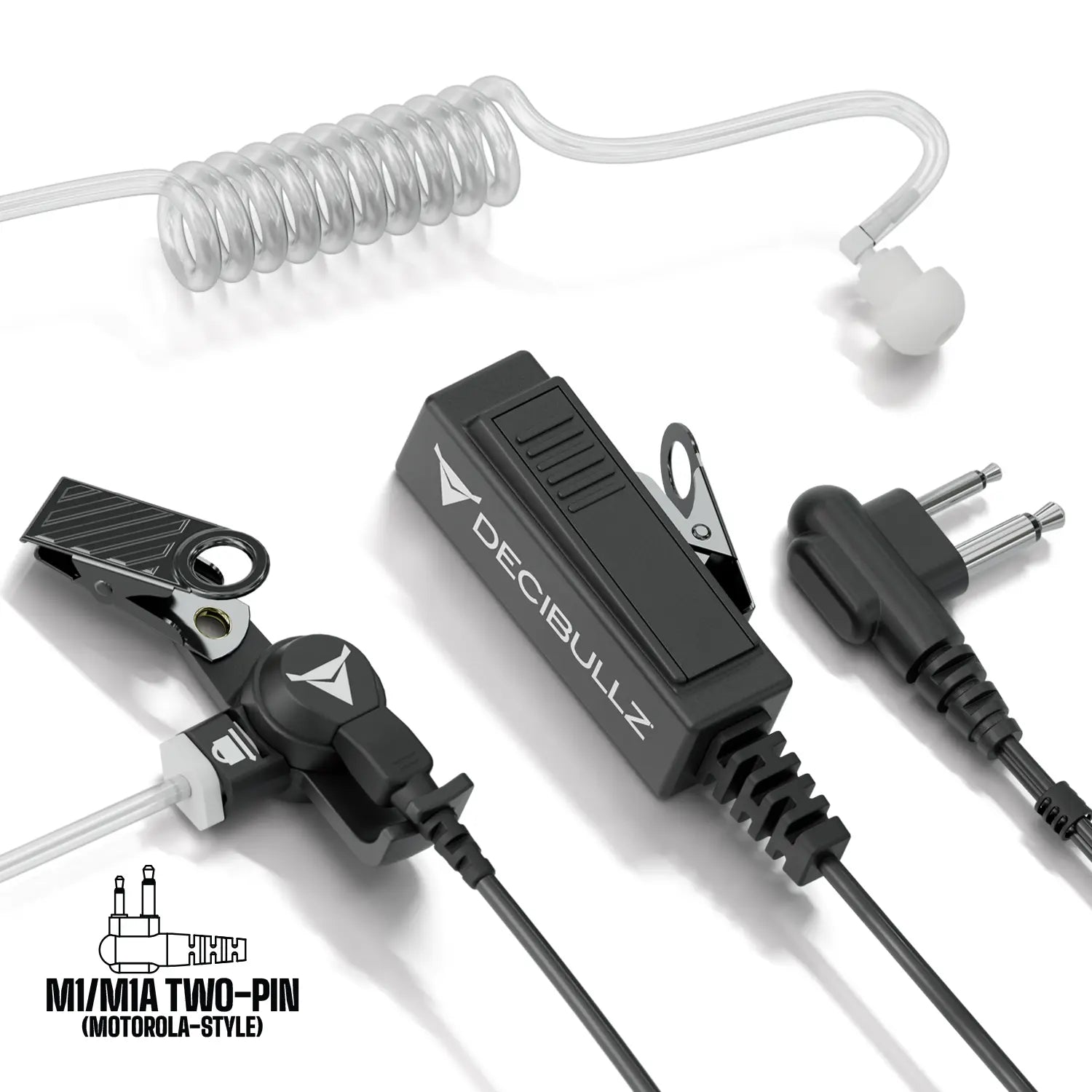 This image showcases the Decibullz Two-Way Surveillance Acoustic Tube Headset (Motorola) with an attached coiled acoustic tube, clip, and two different connectors. The black-and-gray accessories use advanced acoustic tube technology. The Decibullz logo is visible on the main part of the device, making it perfect for a two-way surveillance headset setup.