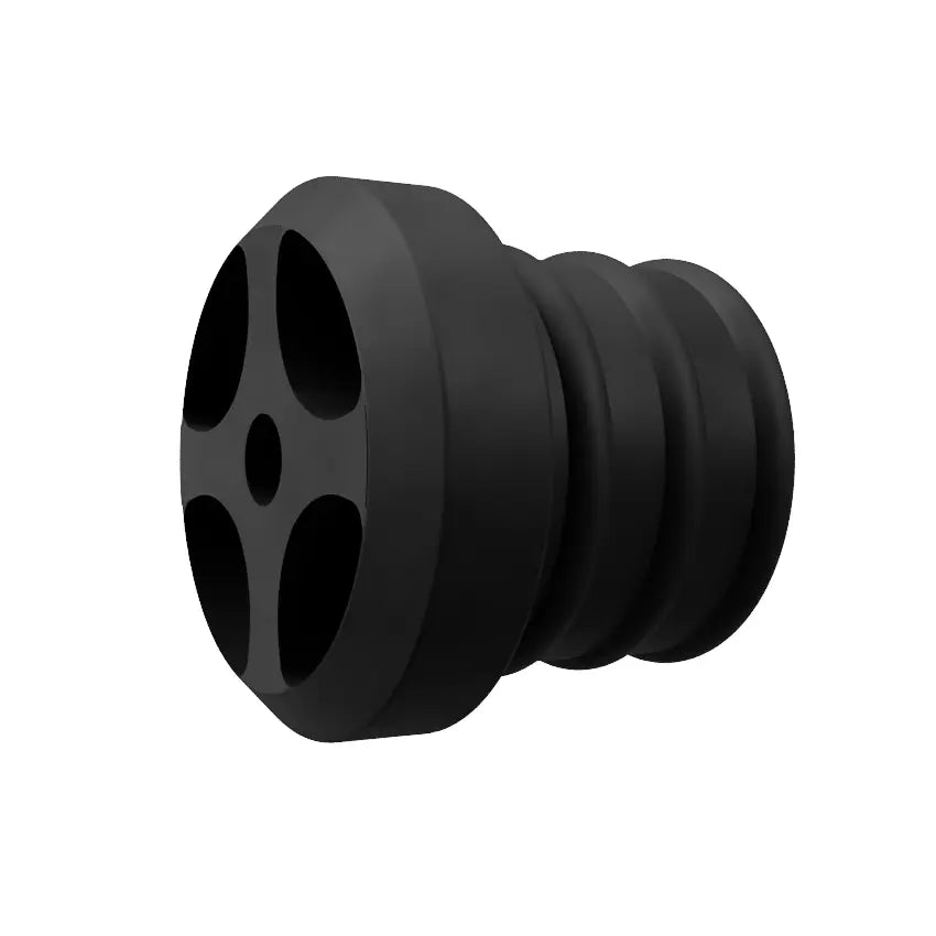 An image of a black Decibullz REPLACEMENT Single +Awareness Radio Adapter Back Plug with multiple grooves and a round, flat end featuring four circular holes arranged in a cross pattern. The stopper appears to be designed for sealing or plugging purposes. White background.