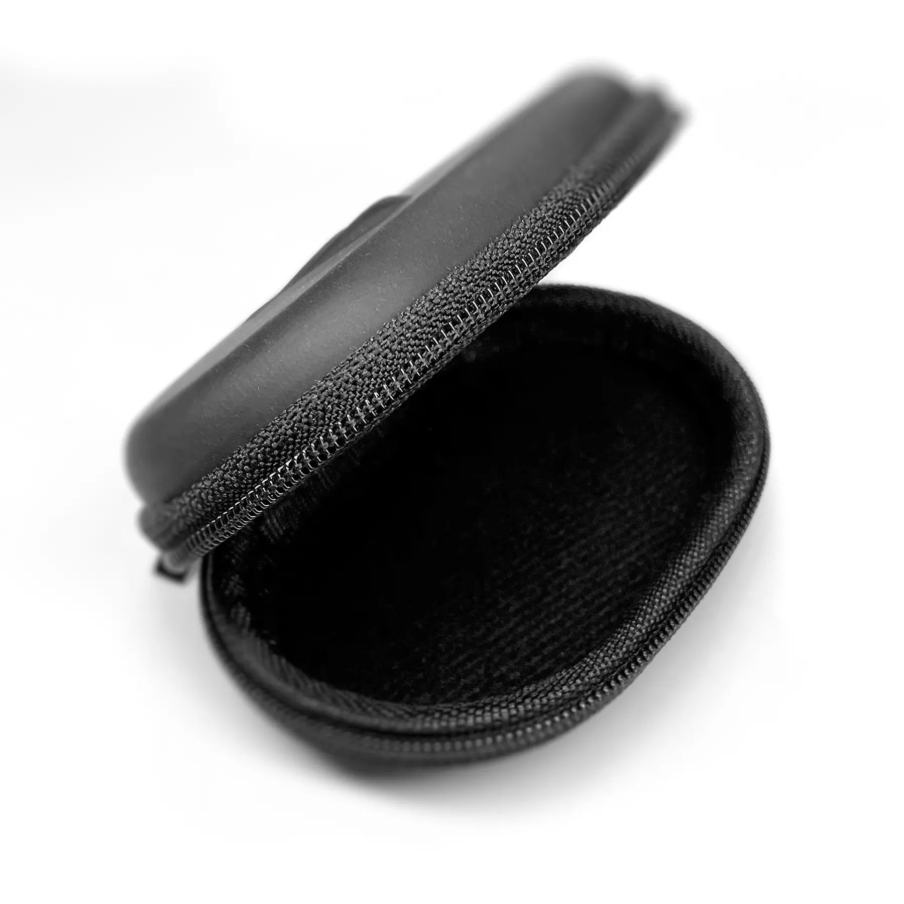 A small, black, semi-open zippered hard case against a white background. The Decibullz Premium Earplug and Earphone Carrying Case has a smooth outer surface and an inner lining designed to protect the contents, perfect for custom-molded earplugs. It appears empty.