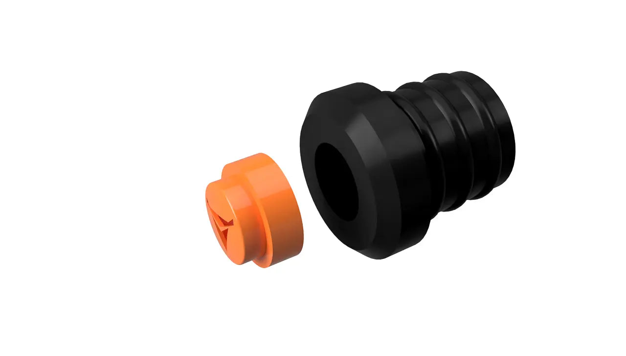 A black cylindrical object with multiple ridges, likely a Decibullz REPLACEMENT Single Percussive Filter, is shown next to an orange cylindrical cap. Both objects are on a plain white background, and the orange cap has a fitted design, indicating it can be attached to the black object for percussive filters use.