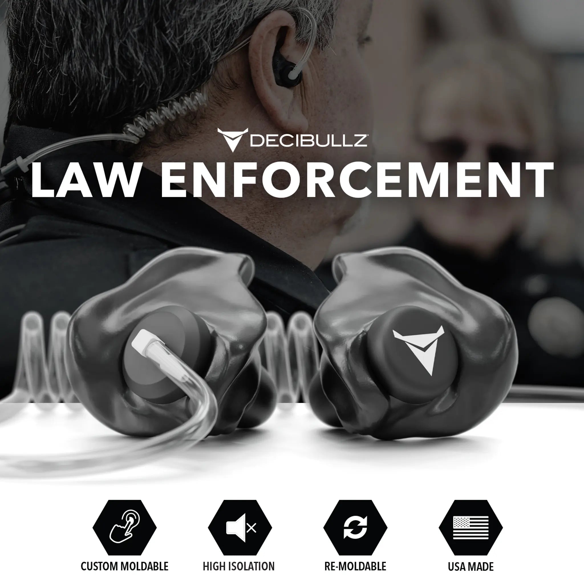A close-up image of a law enforcement officer wearing Custom Moldable Surveillance Radio Headset Earpieces with Isolation by Decibullz, ideal for mission critical situations. The earpieces are highlighted in the foreground. Icons below the image indicate features: custom moldable, high isolation, re-moldable, and USA made.