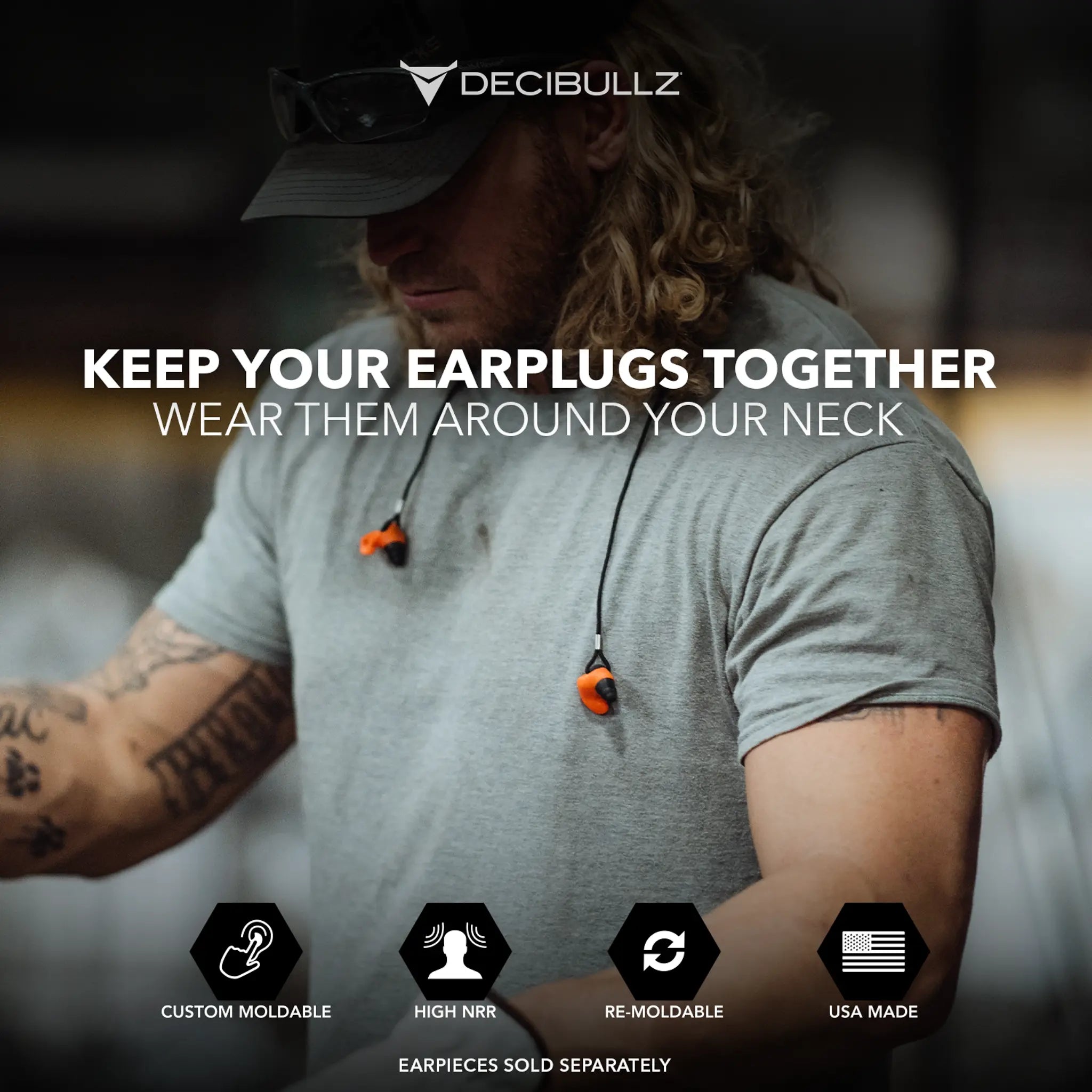 A person with long hair wearing a cap and a grey shirt has orange earplugs hanging from a premium Custom Molded Earplug Lanyard around their neck. The text on the image promotes Decibullz Custom Molded Earplug Lanyard, highlighting features like custom moldability, high NRR, re-moldability, and being USA made.