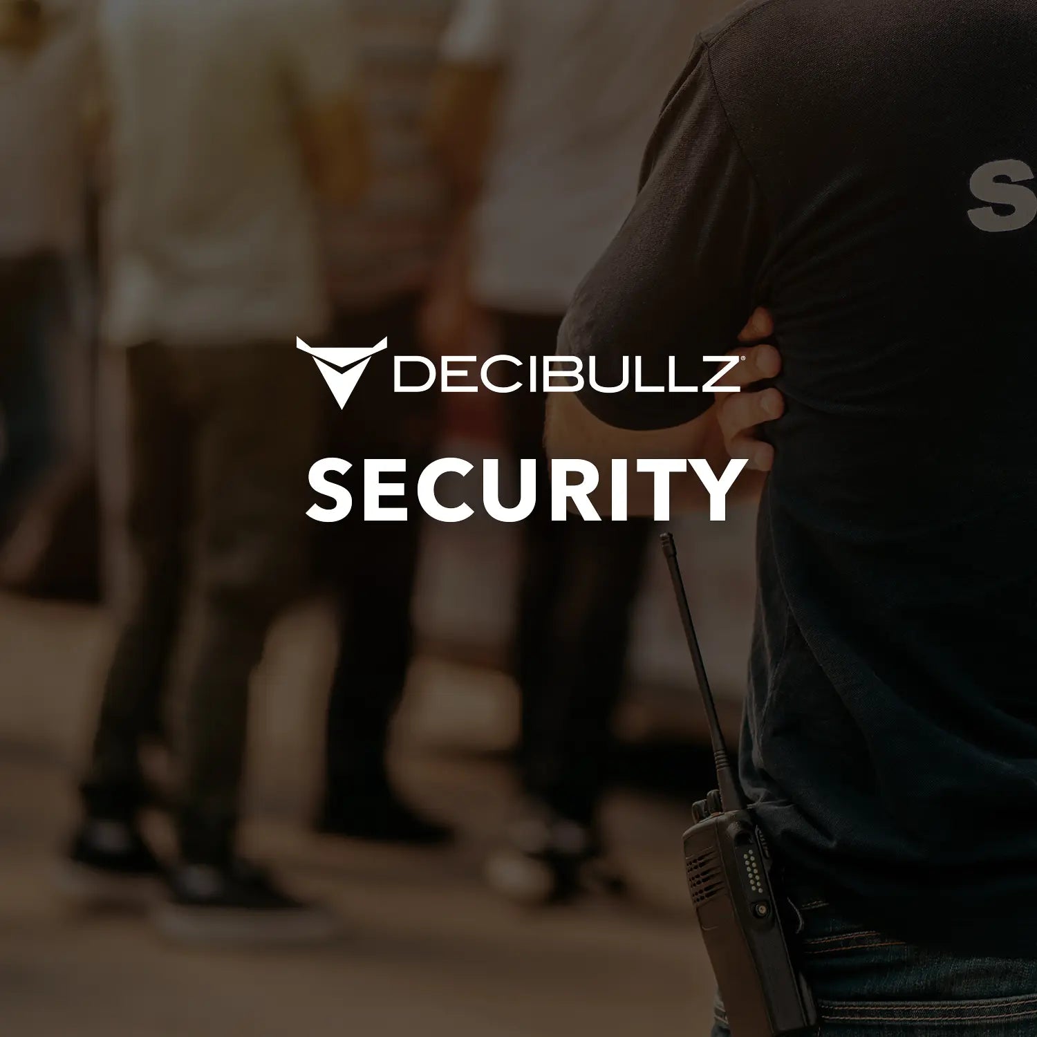 A person wearing a dark shirt with "Security" on the back stands with a walkie-talkie attached to their belt, using Decibullz custom molded earpieces through a Decibullz Premium Listen-Only Surveillance Acoustic Tube Headset. The background shows several blurry individuals, and the Decibullz logo and the word "Security" are prominently featured in the center.