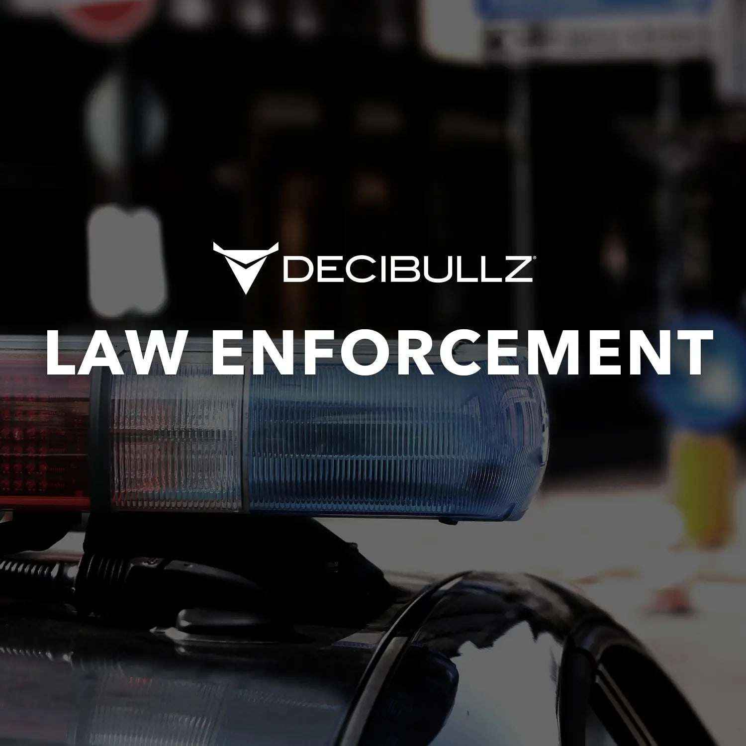A marketing image for Decibullz Premium Listen-Only Surveillance Acoustic Tube Headset featuring text "LAW ENFORCEMENT" and a blurred background showing a police vehicle's blue and red emergency lights.
