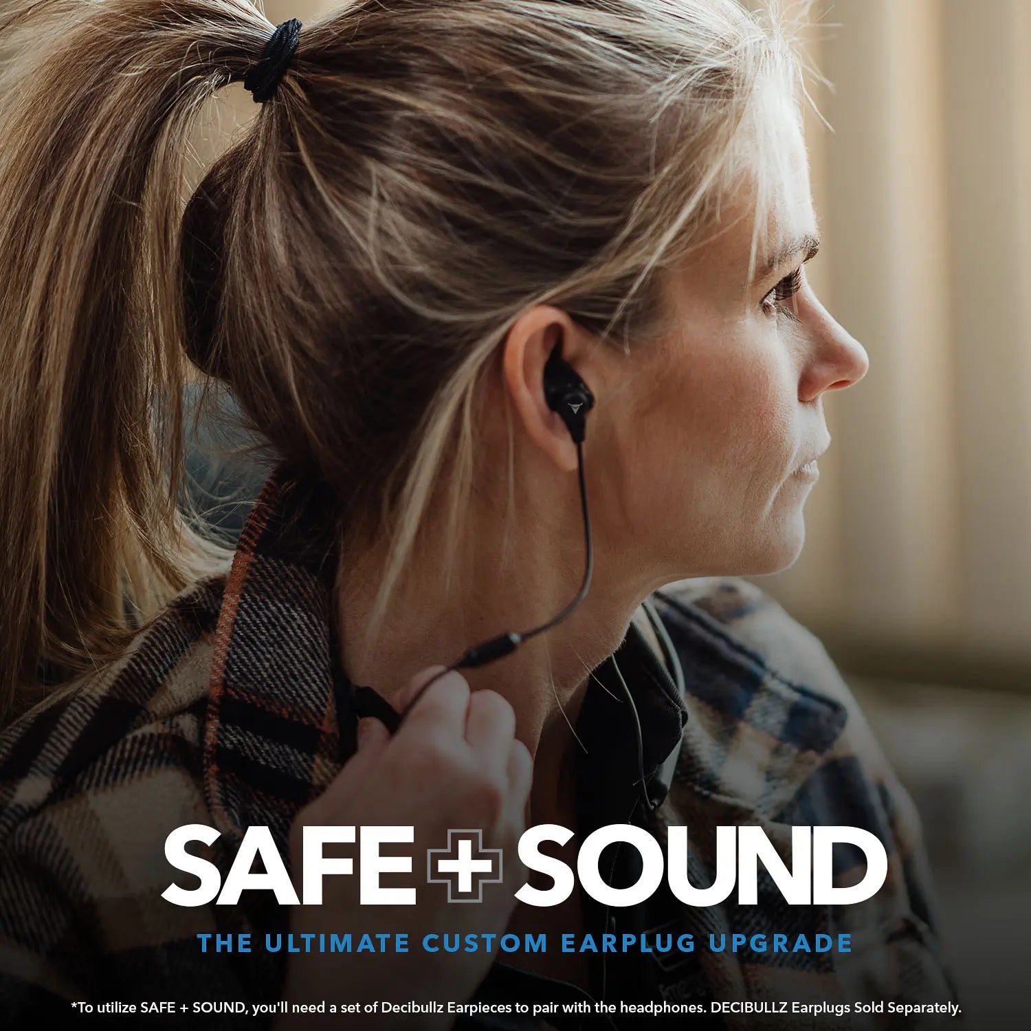 A woman with blonde hair tied back is wearing a plaid shirt and looking to her left. She is using black earphones. Text at the bottom reads: "Decibullz SAFE + SOUND Wireless Headphone Conversion Kit: The Ultimate Custom Earplug Upgrade." Additional text highlights the Noise Suppression Technology incorporated into these custom molded headphones.